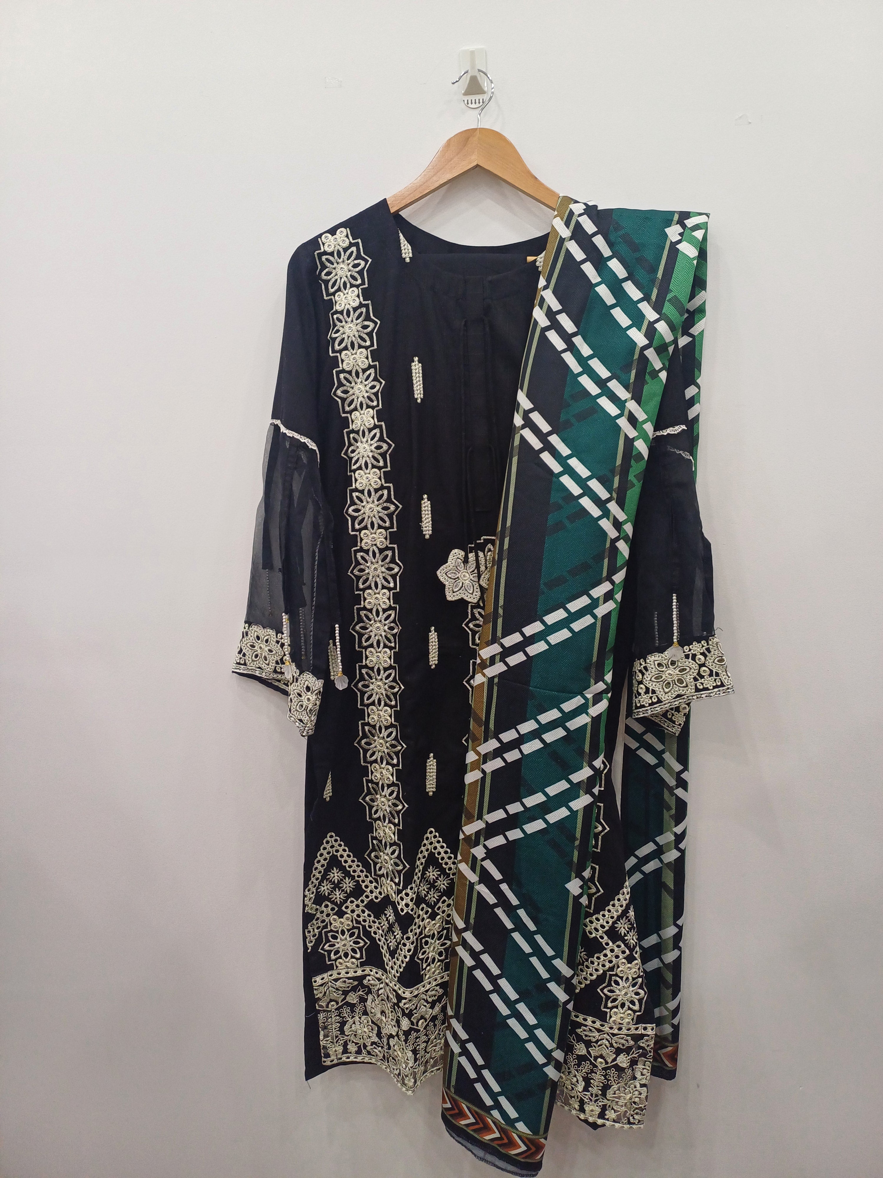 Full view of black embroidered kurta set with matching dupatta