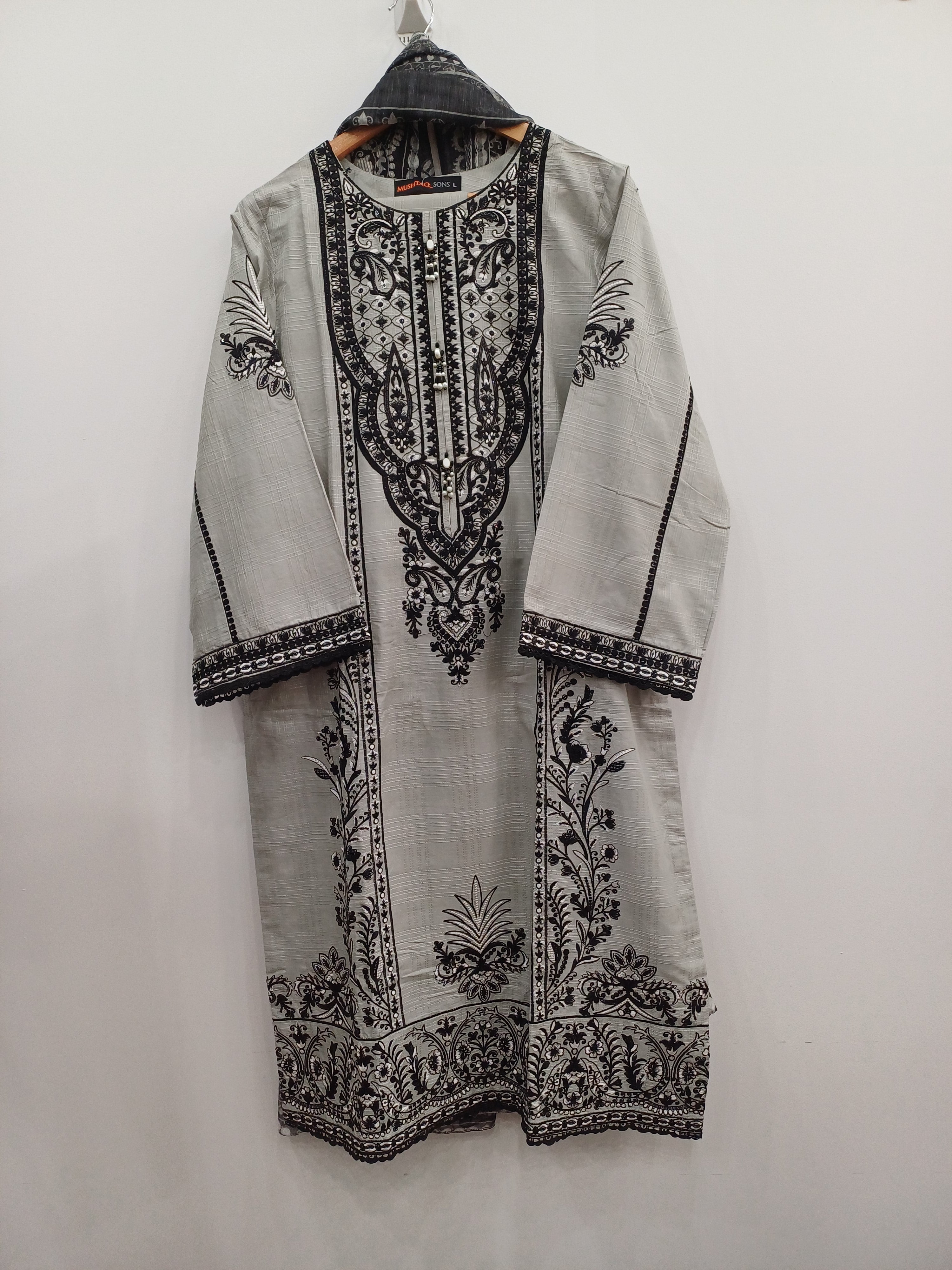 Intricate floral hem embroidery on gray slub cotton festive suit