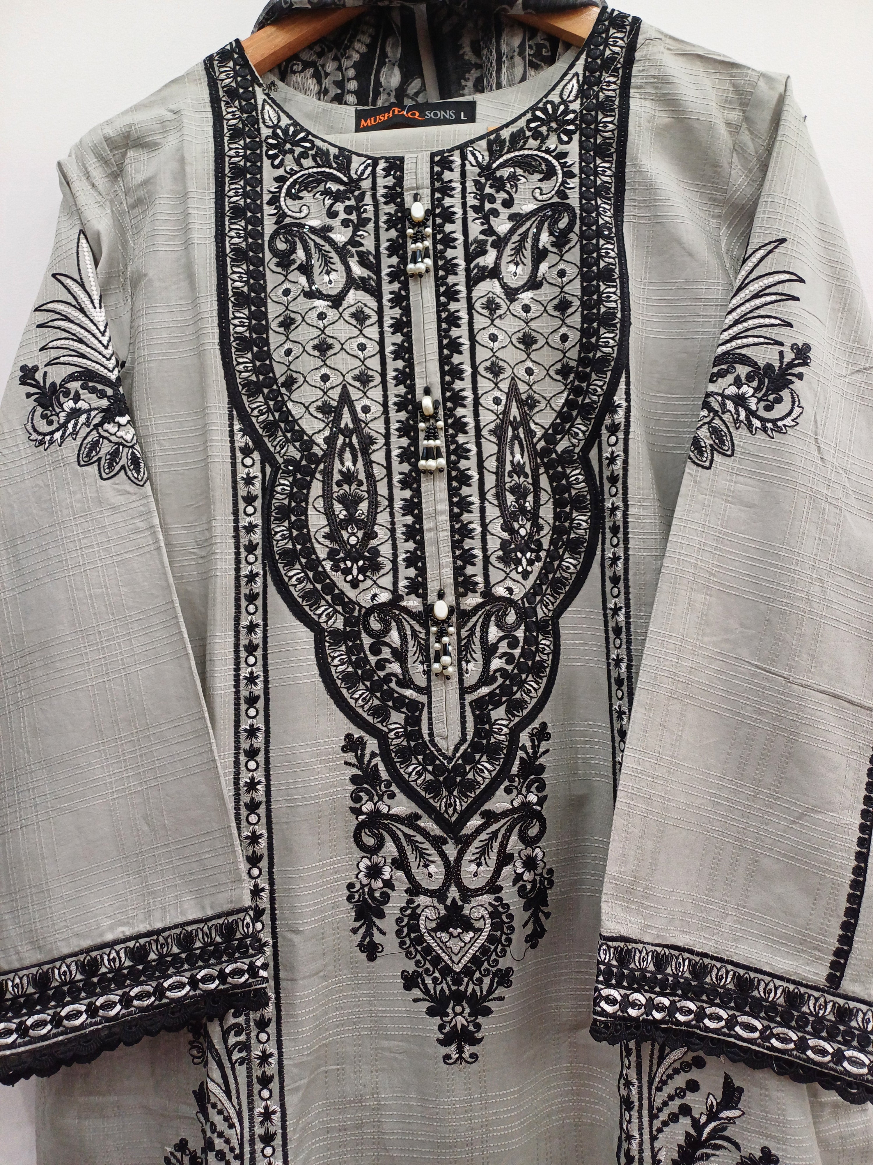 Intricate floral hem embroidery on gray slub cotton festive suit