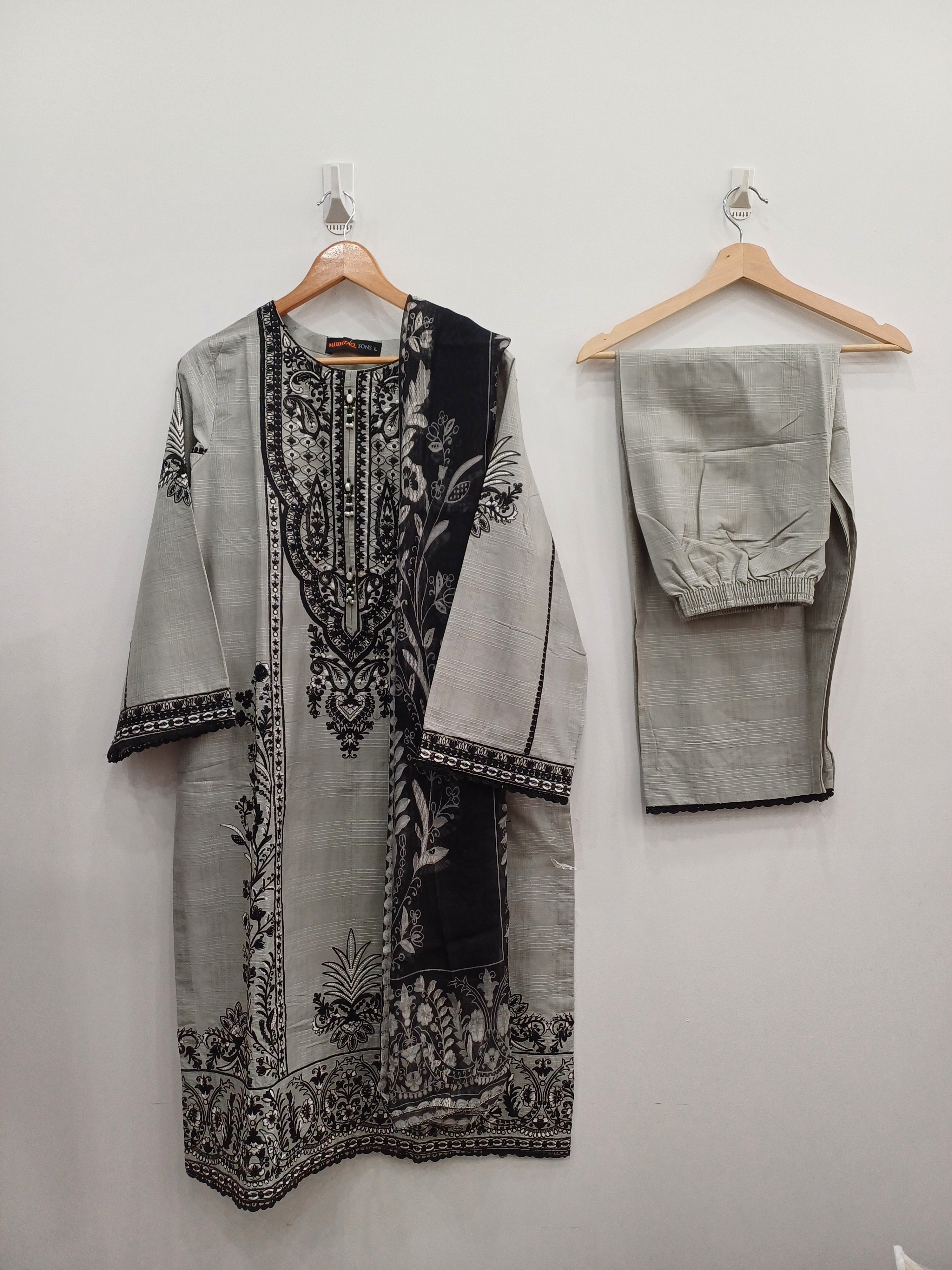 Gray slub cotton 3-piece embroidered suit with black threadwork and Khaddi net dupatta