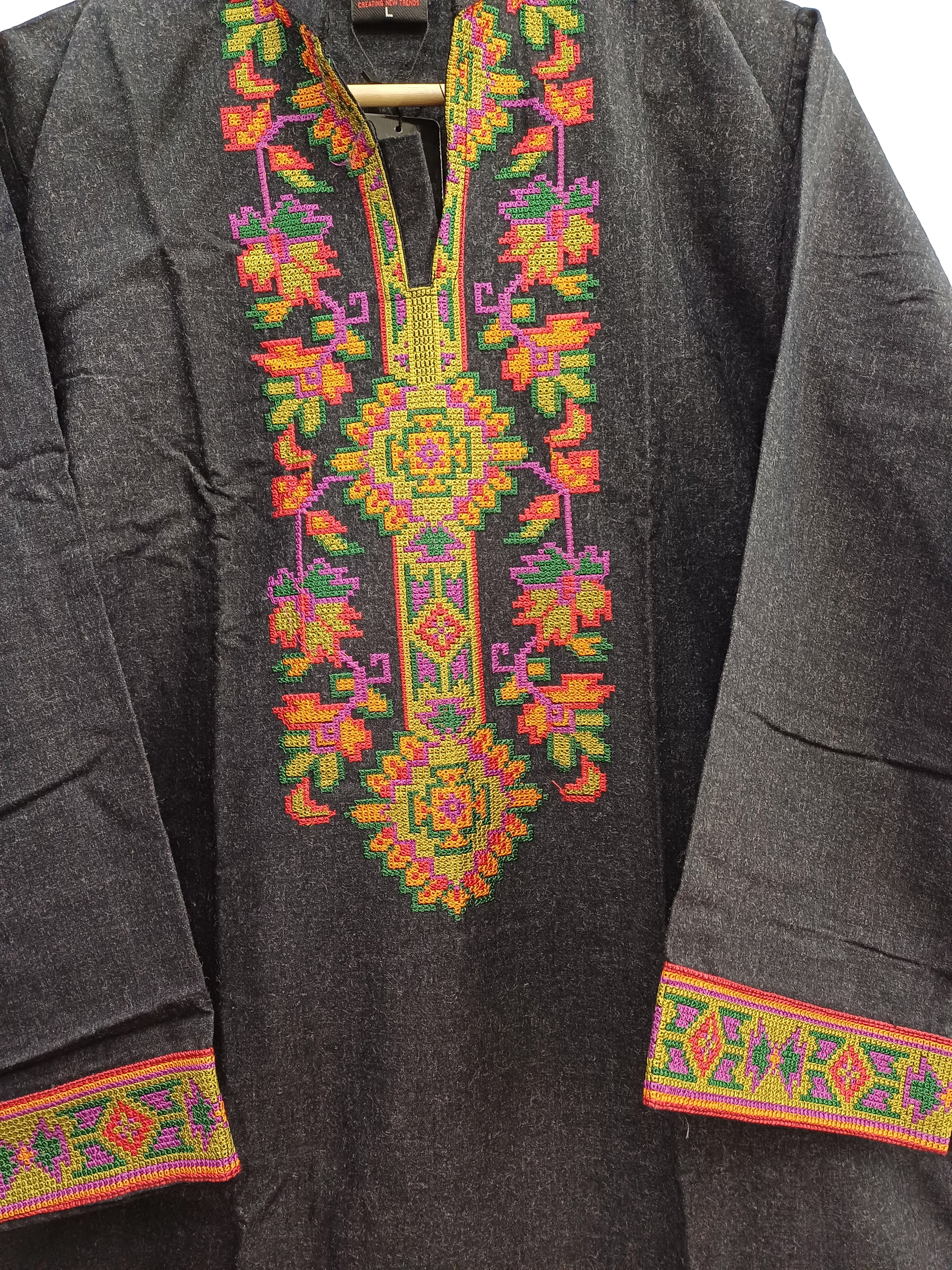 Close-up of neckline embroidery with multicolor floral detailing