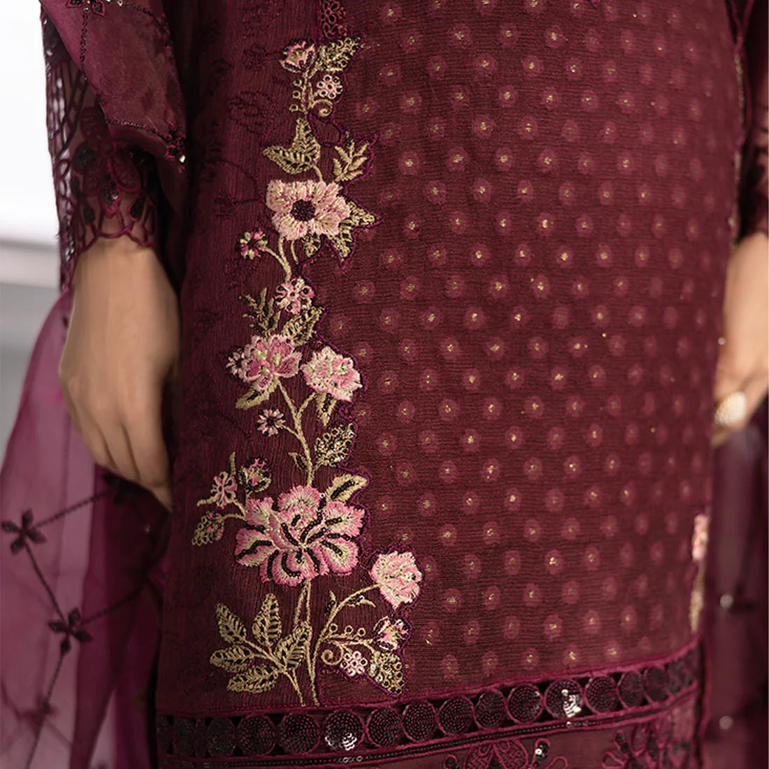Plum base hand-embellished cotton net shirt with embroidered border, organza dupatta with finished pallu, and Russian Grip trouser