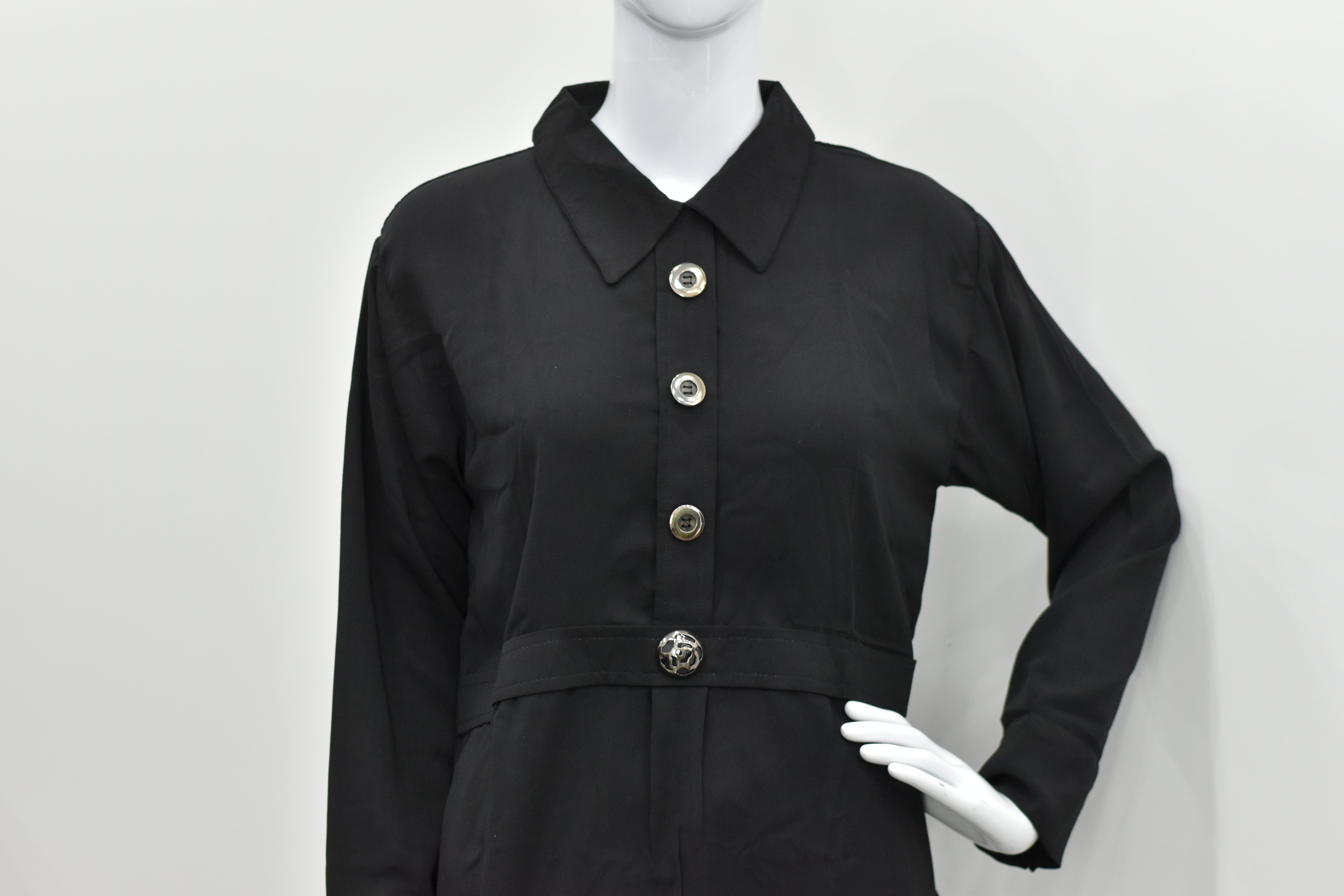 Black belted shirt-style top with statement buttons and long sleeves for women