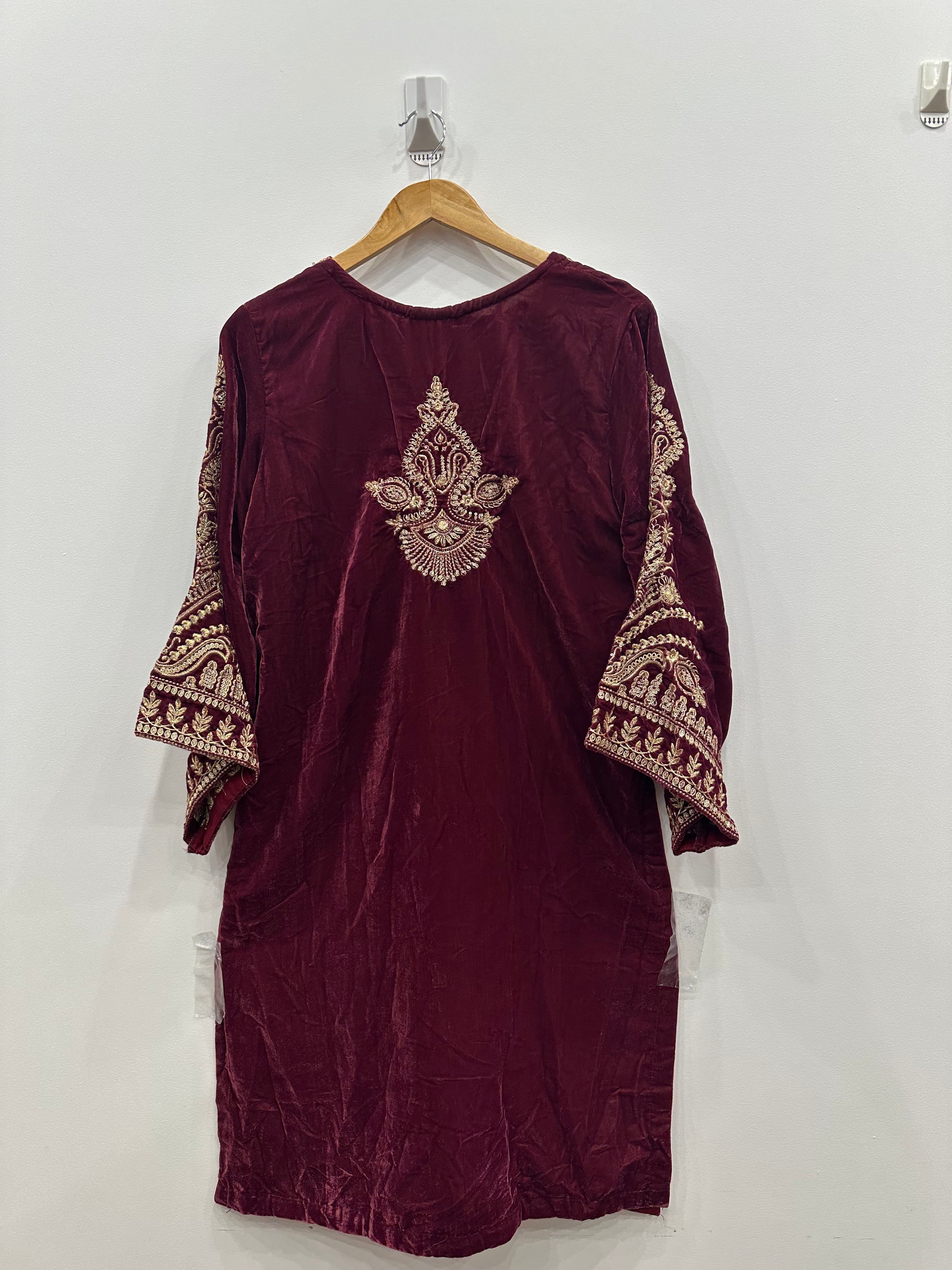 Back view of maroon velvet kurta featuring elegant embroidered motif and matching embroidered shawl