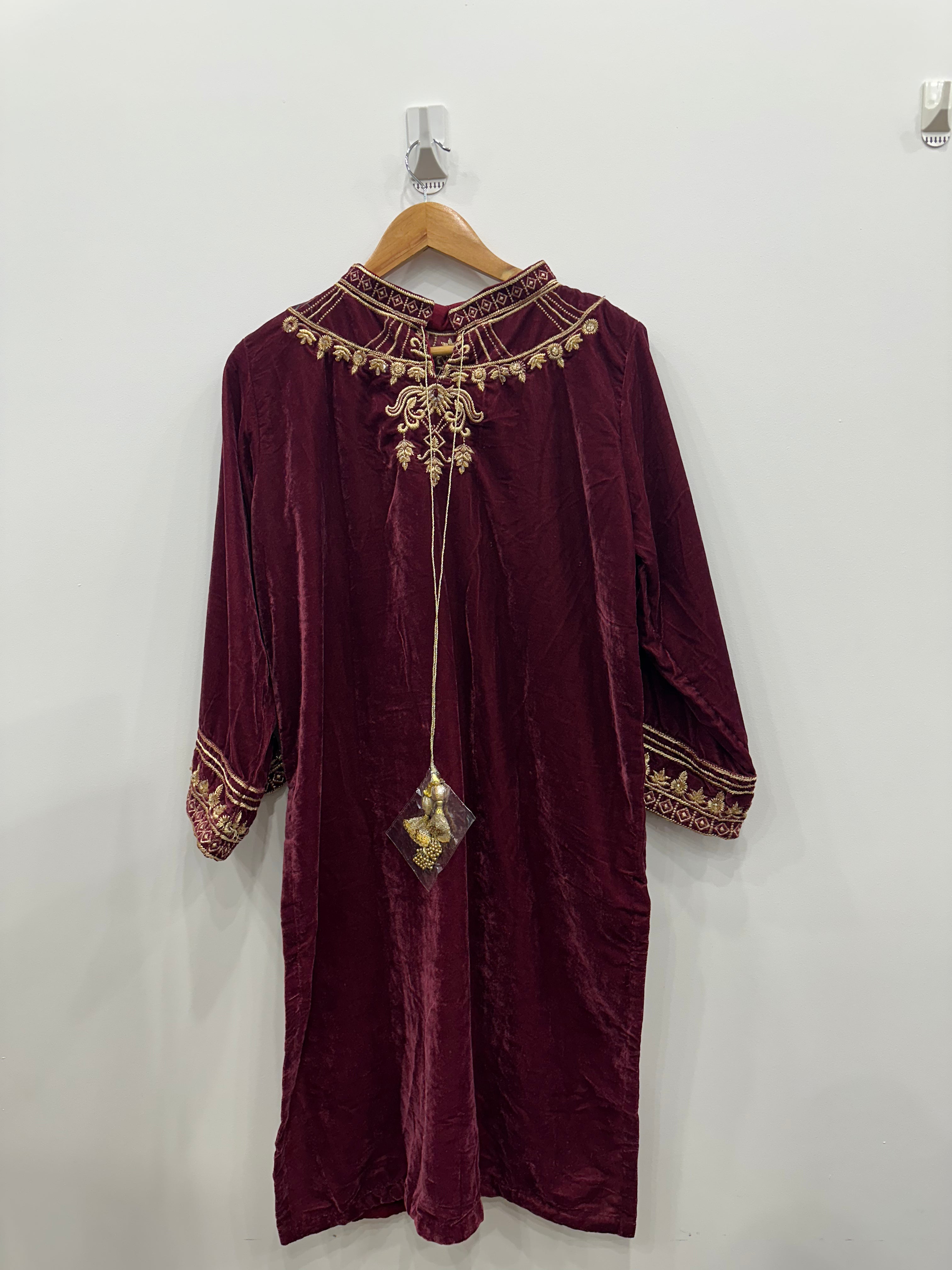 Maroon velvet kurta set with fancy embroidered neckline, tila work, beads, pearls, and embroidered shawl