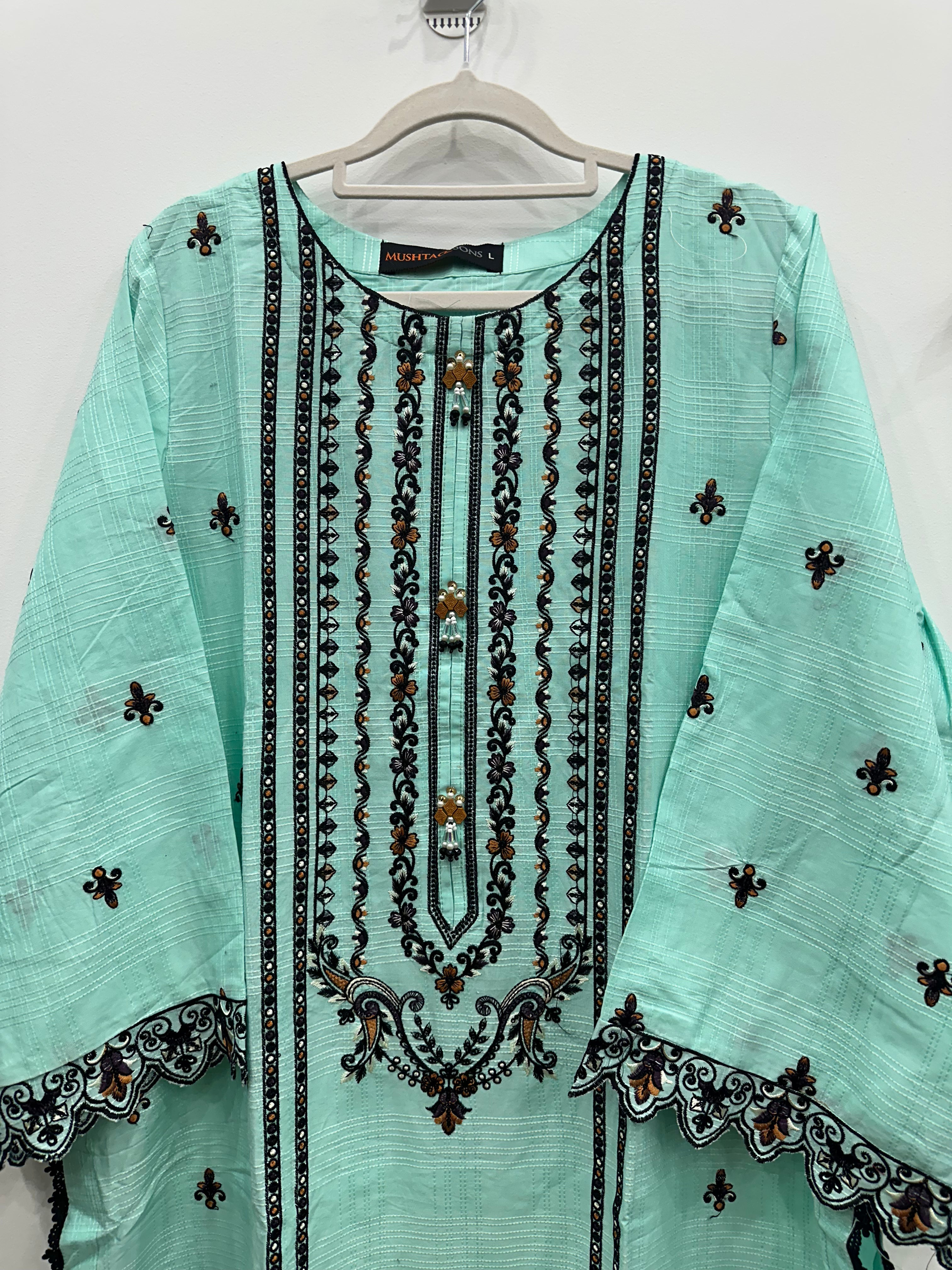 Close-up black embroidery on aqua slub cotton kurta front