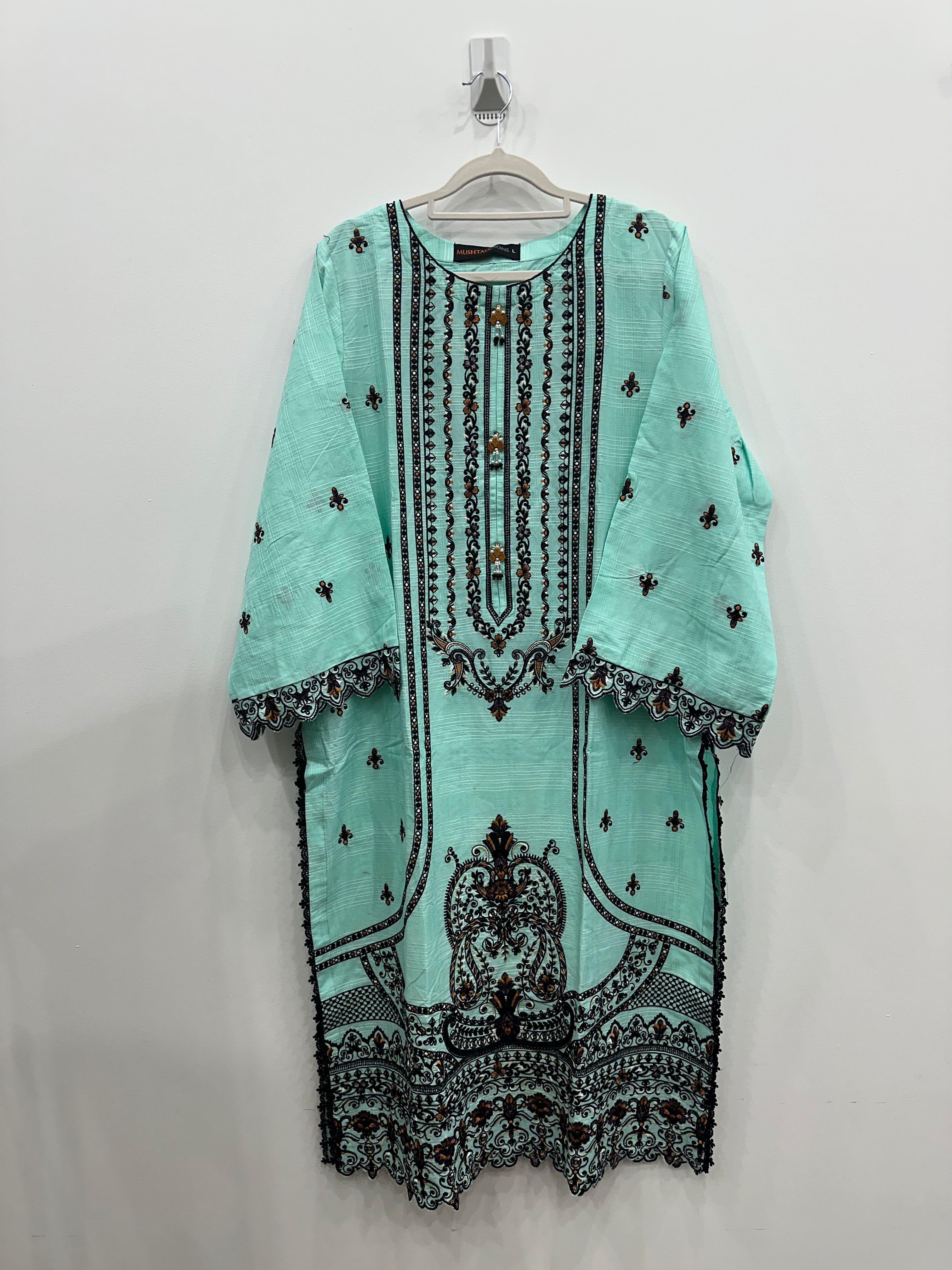 Light blue dress with black embroidery on a white background