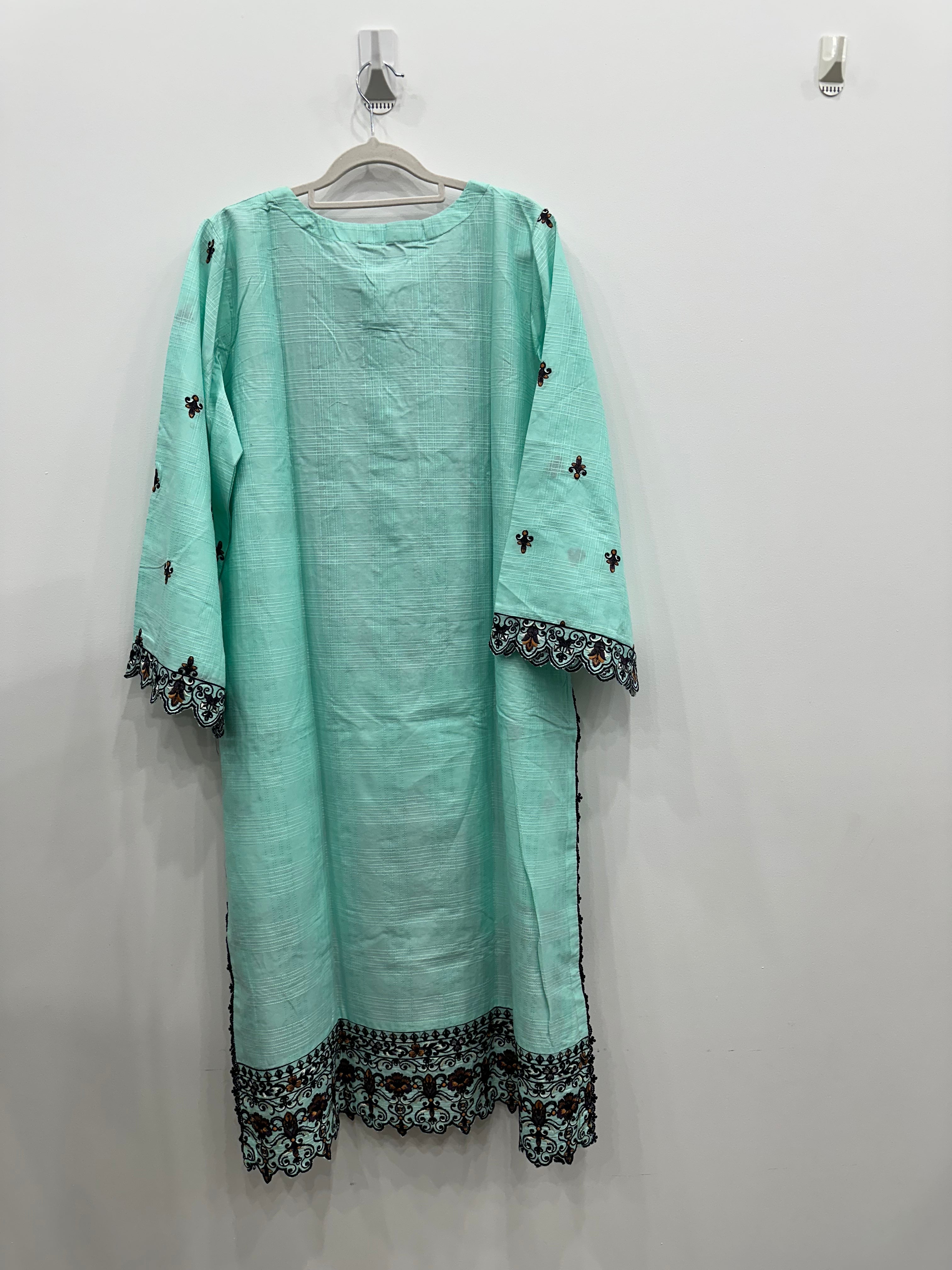 Light blue kurta with black embroidery on a white background