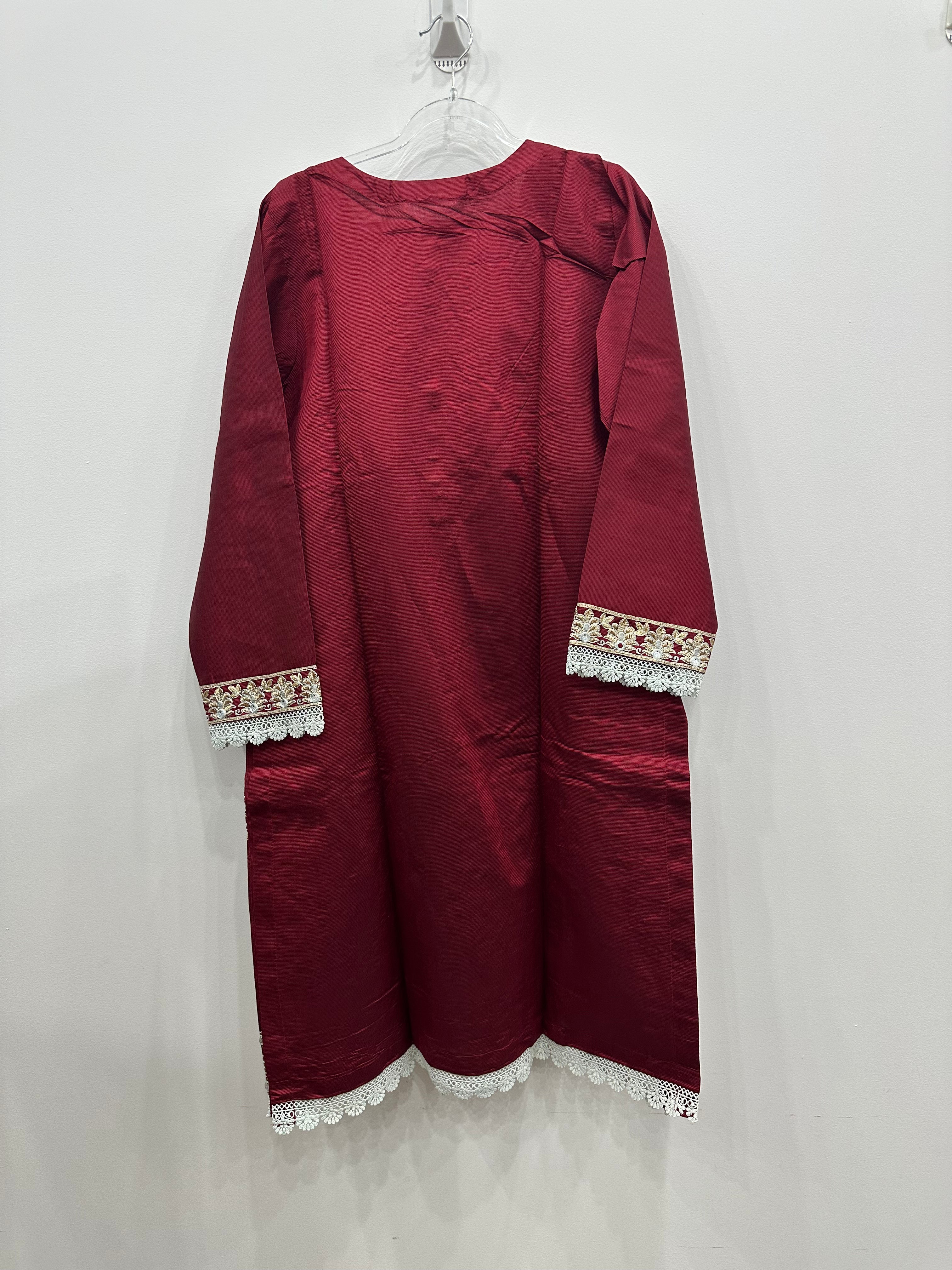 Full view of red khaddi net embroidered kurta and matching trousers