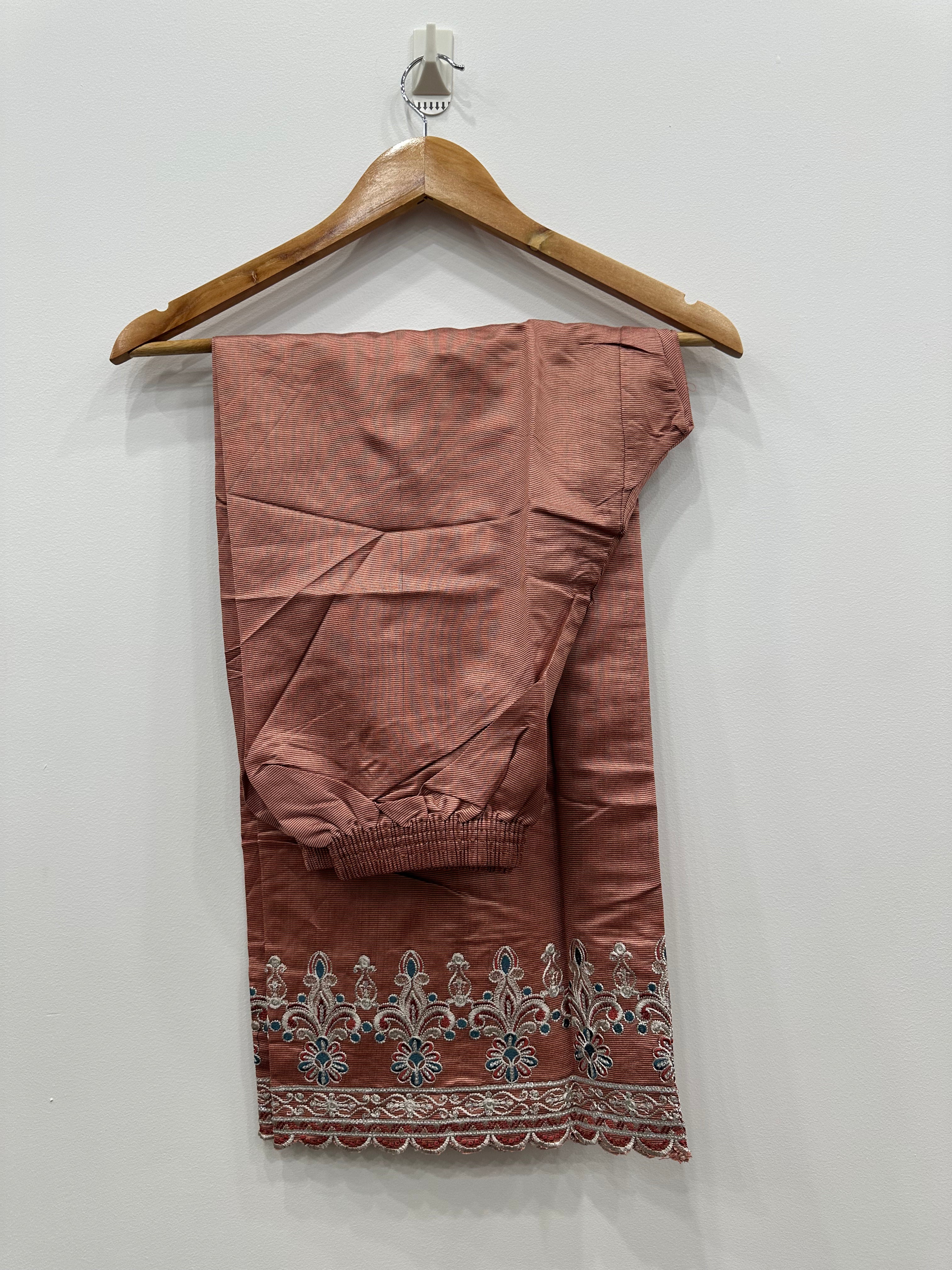 Close-up embroidery detail on khaddi net kurta