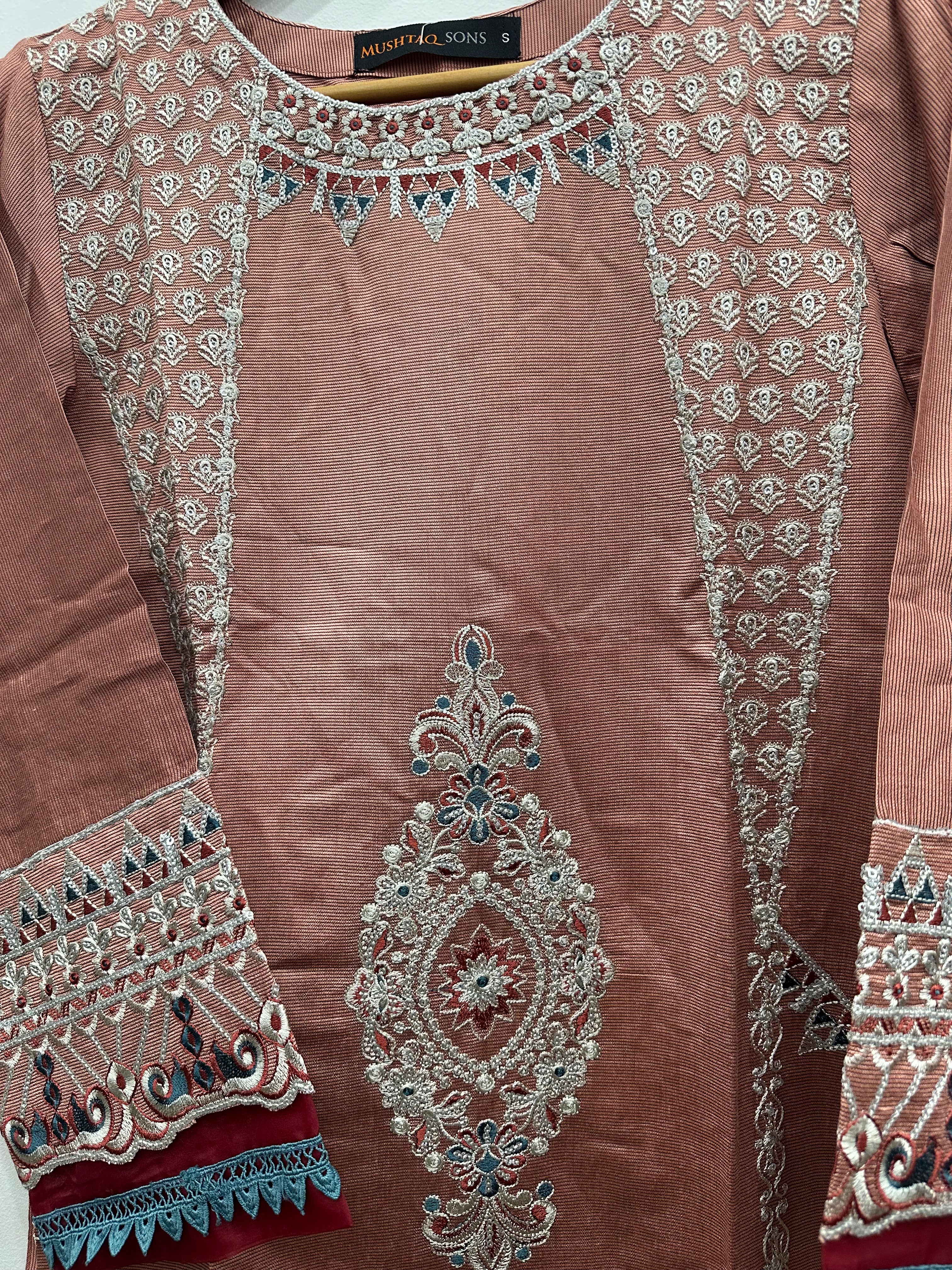 Close-up embroidery detail on khaddi net kurta