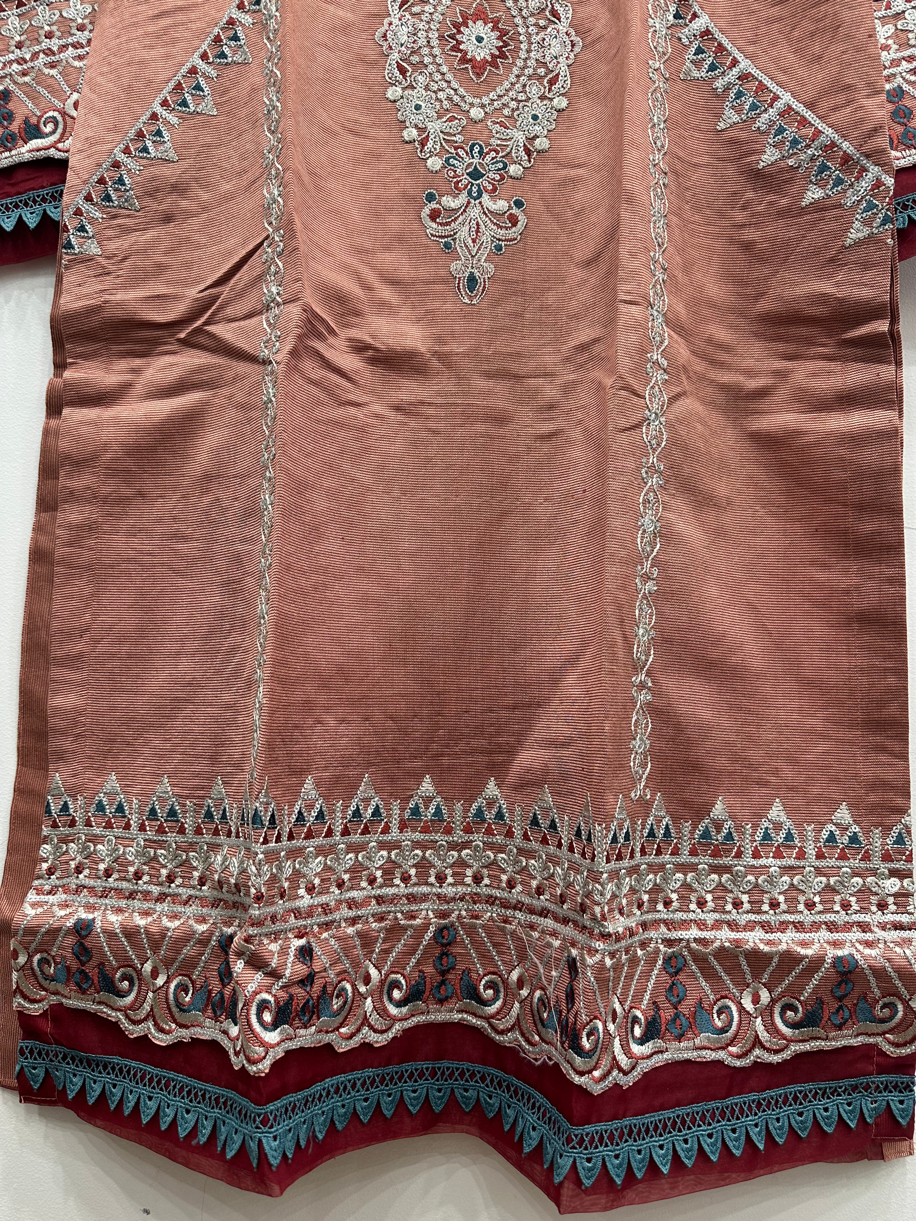 Close-up embroidery detail on khaddi net kurta
