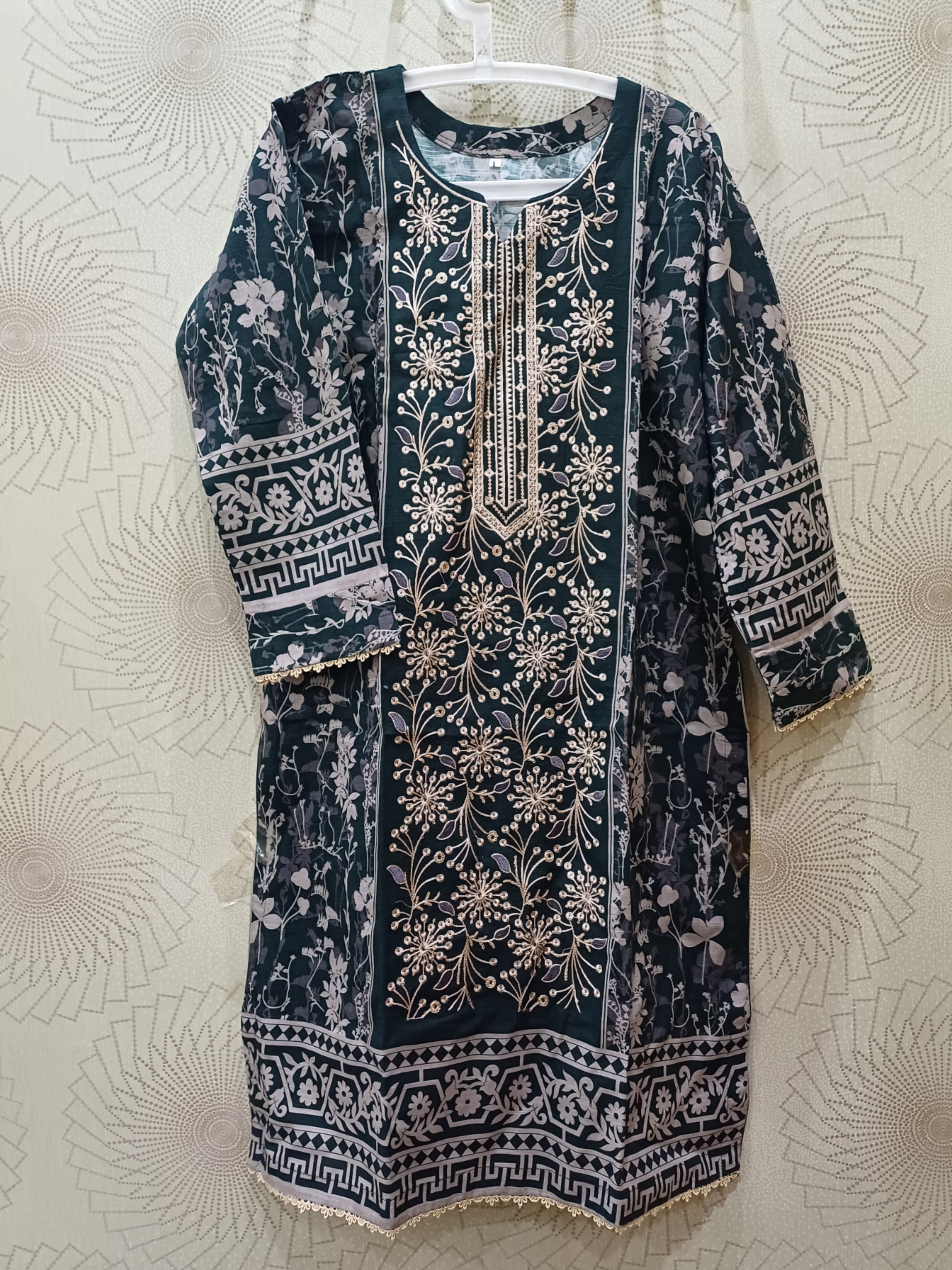 Elegant green khaddar winter dress with skin embroidery details