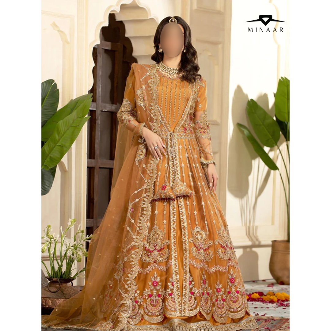 Orange embroidered traditional outfit with 'Minaar' branding in a decorative setting.