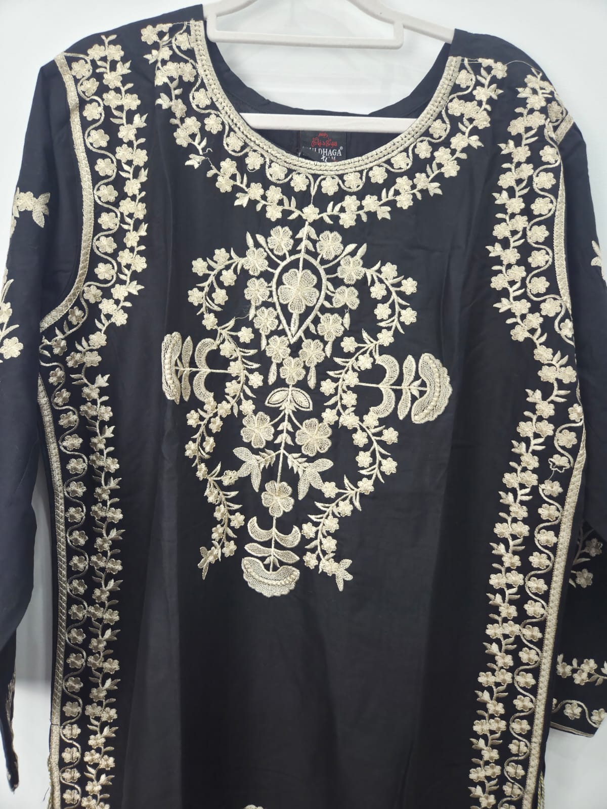 Black cotton lawn shirt with skin embroidery and side tassels