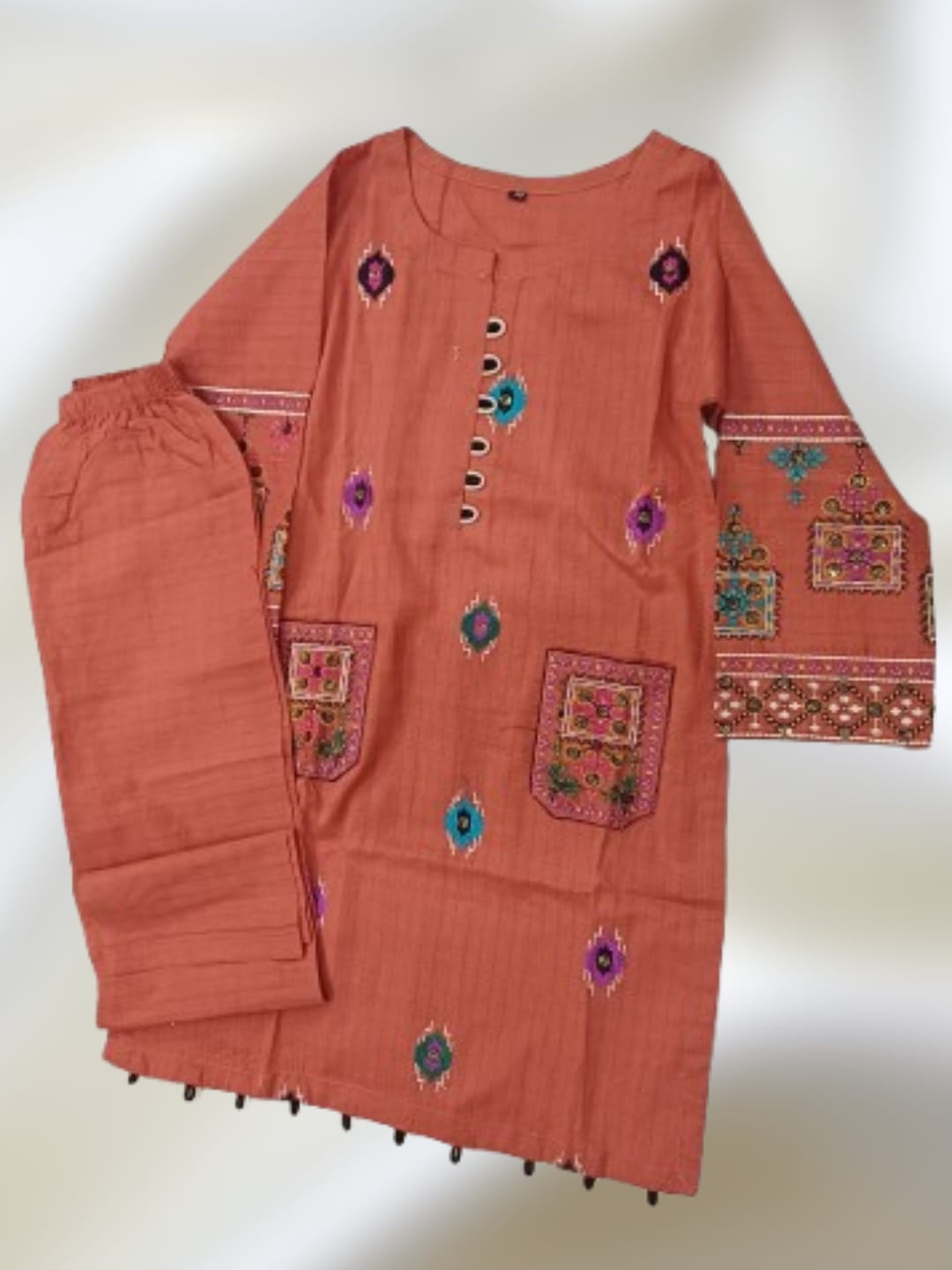 2 piece girls Pakistani suit with multicolor embroidered kurta, embroidered pockets and matching trouser