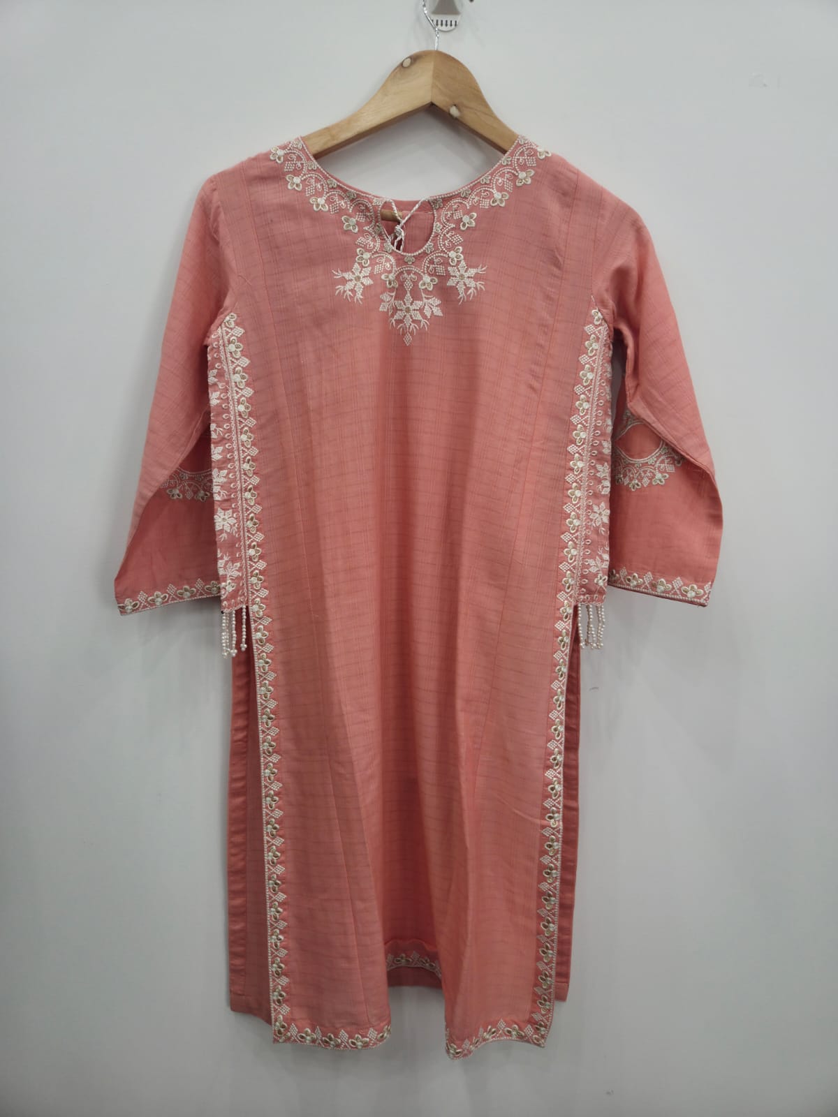 Dusty pink 2 piece girls Pakistani suit with white embroidered kurta, hanging pearl tassels and matching trouser