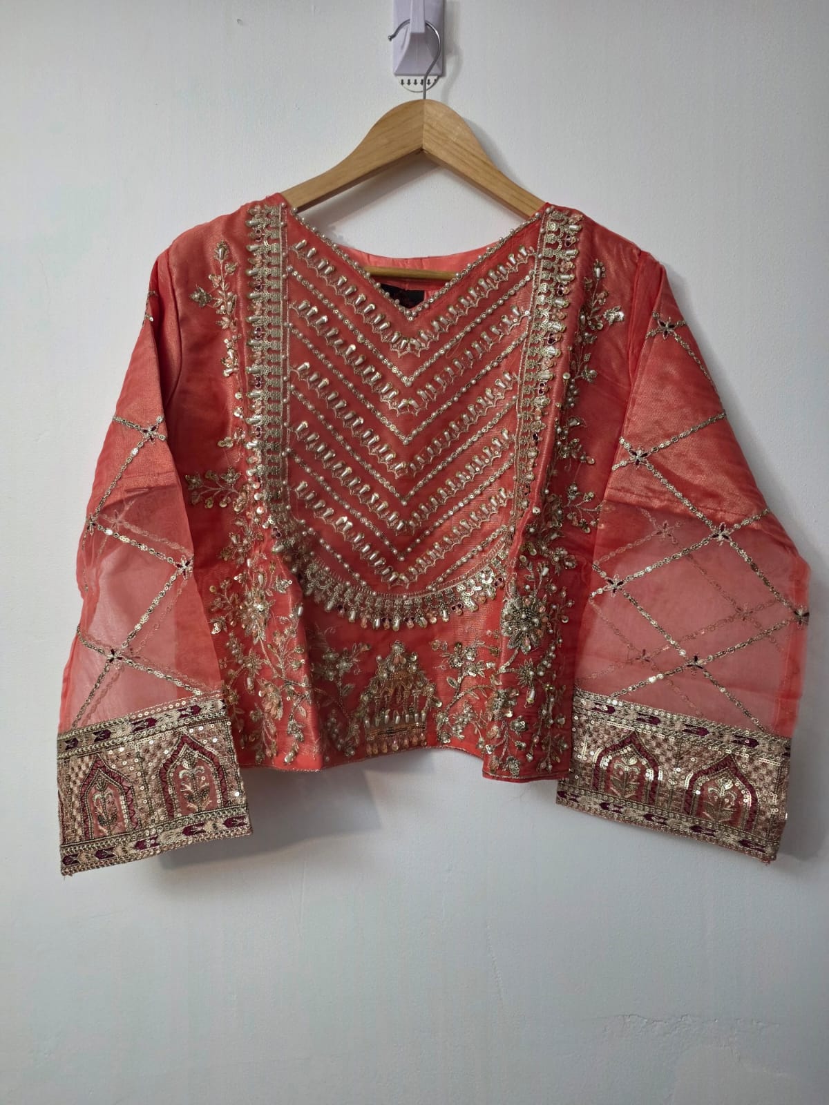 Embroidered organza lehenga with pearl detailing and choli