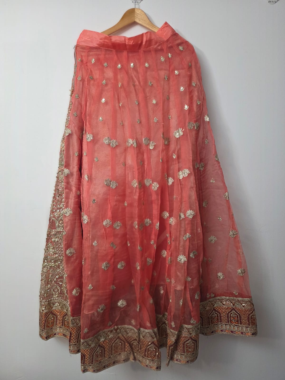 Embroidered peach choli and flared wedding lehenga