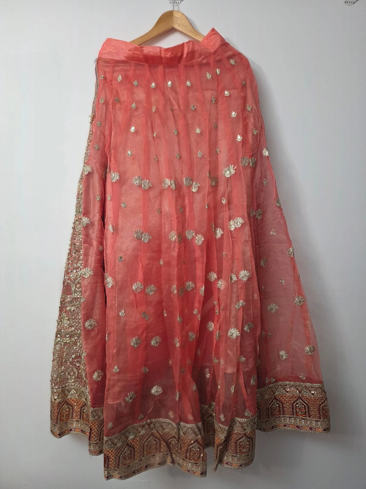 Embroidered peach lehenga with pearl detailing and organza dupatta