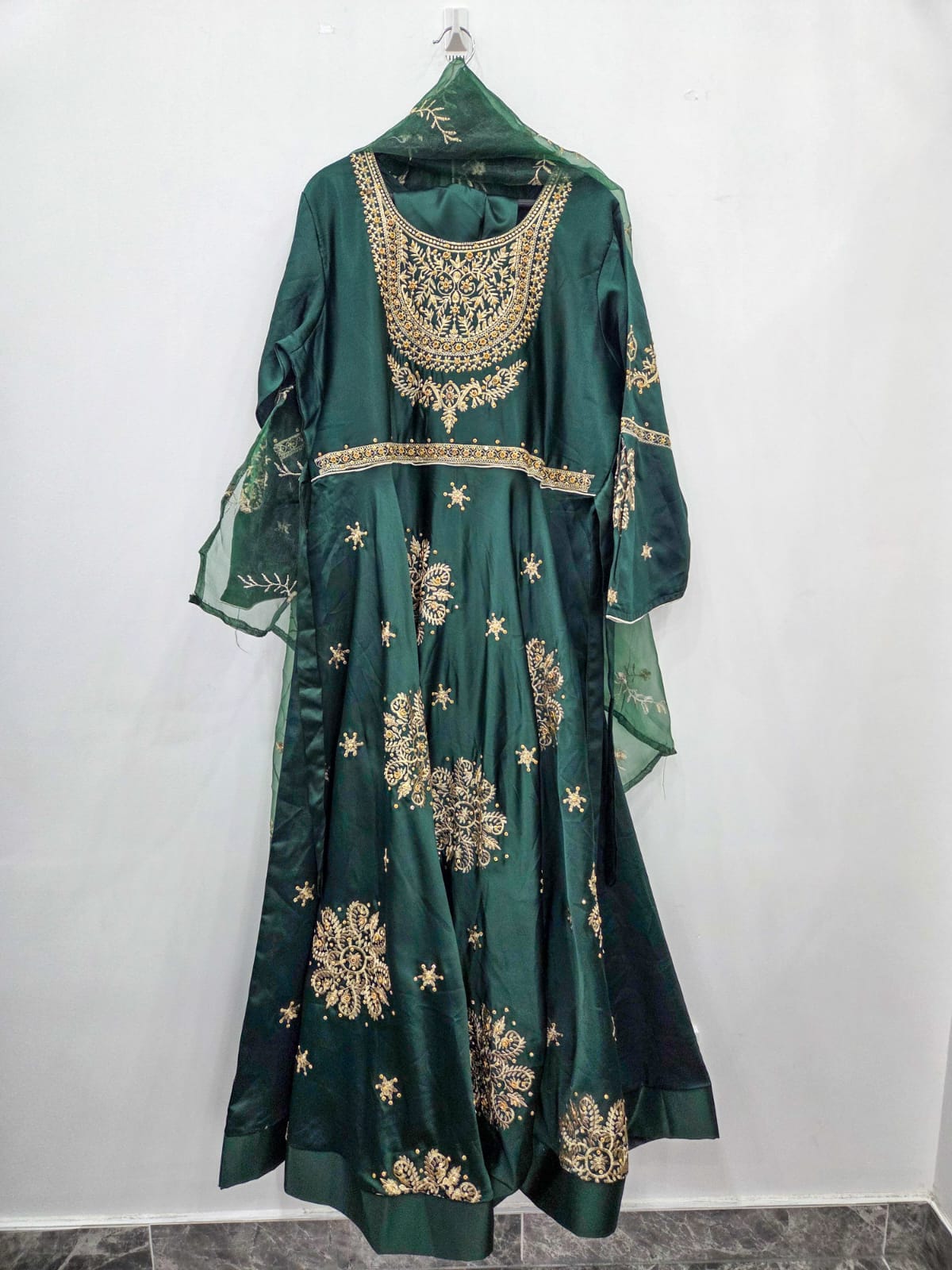 Emerald green silk Pakistani maxi with golden Tilla and bead work and matching net dupatta