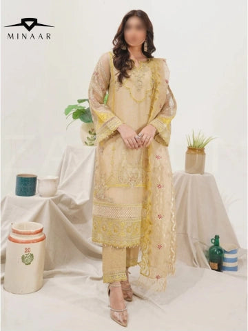 Woman wearing a light yellow embroidered outfit with a white background, featuring Minaar branding.