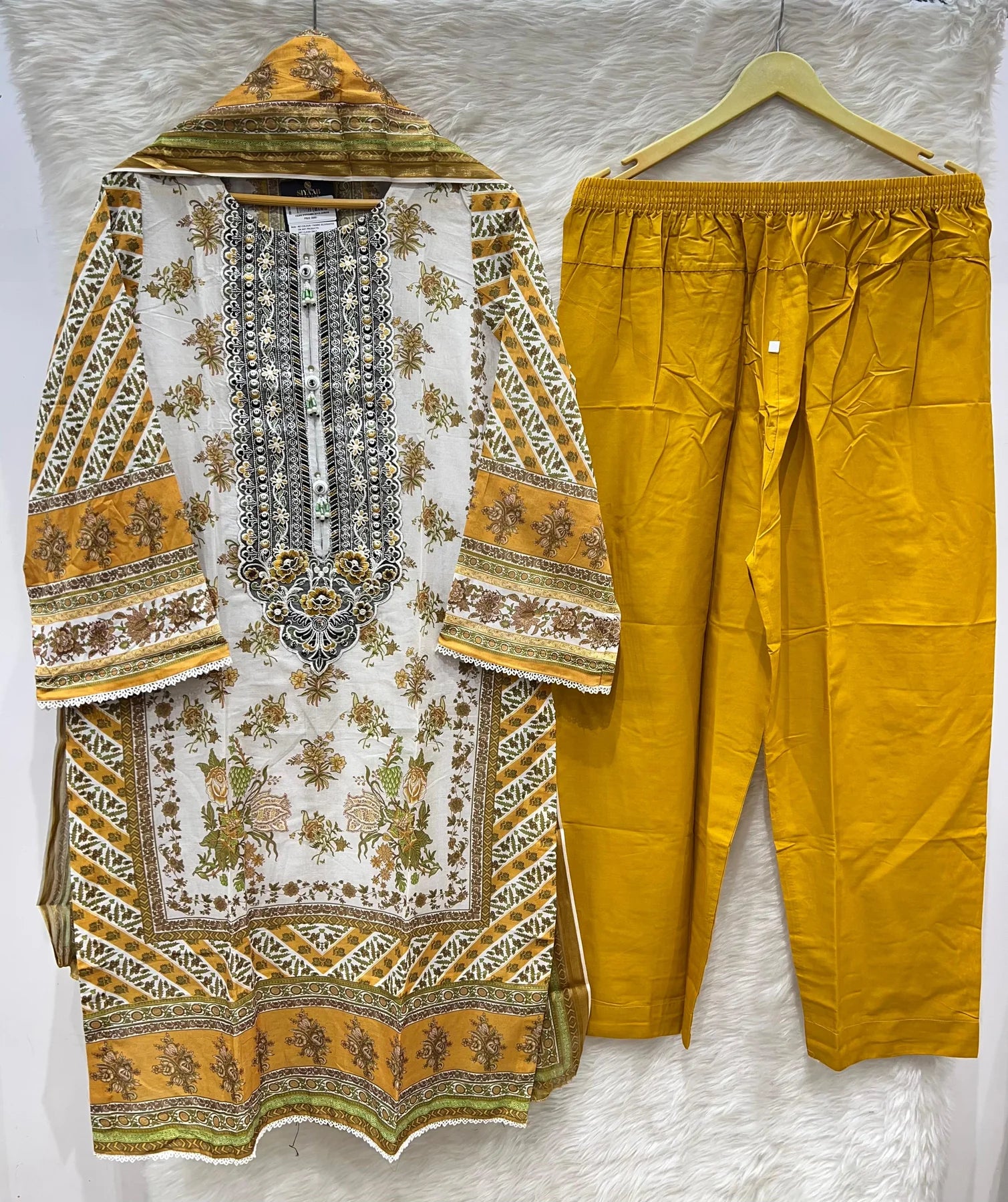 Mustard and ivory Pakistani 3 piece lawn suit with heavily embroidered kameez, embroidered lawn dupatta and printed trouser