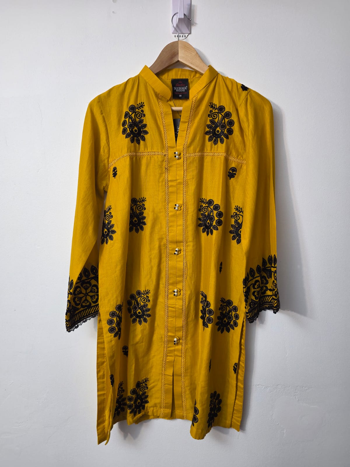 Mustard yellow slub cotton Pakistani 1 piece kurta with black floral embroidery and embroidered sleeve borders
