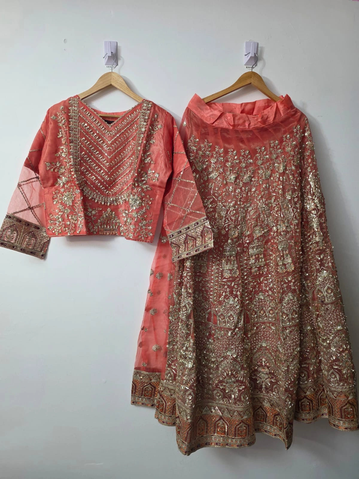 Pakistani peach flared lehenga with embroidered choli and pearl border