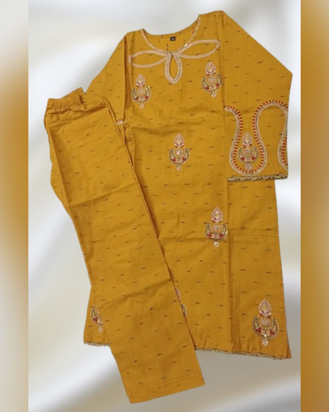Pakistani suit with tilla embroidered kurta and matching trouser