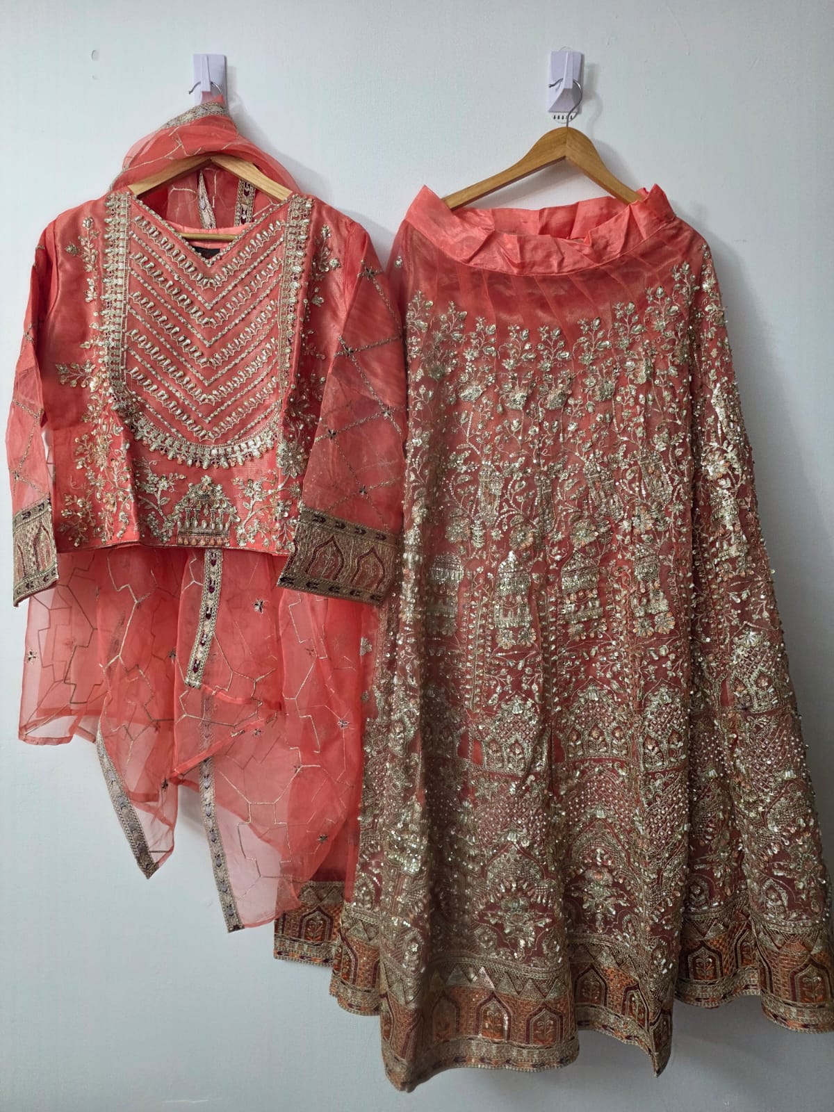 Peach embroidered organza Lehenga Choli with pearl border