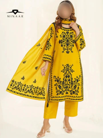 Yellow embroidered outfit with black patterns on a white background, featuring the Minaar brand.