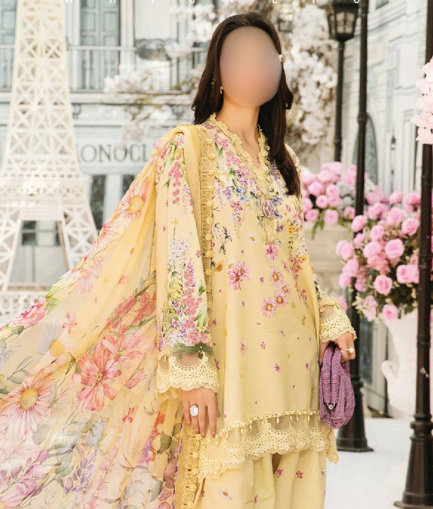Yellow floral embroidered lawn suit with printed chiffon dupatta and cambric trousers.